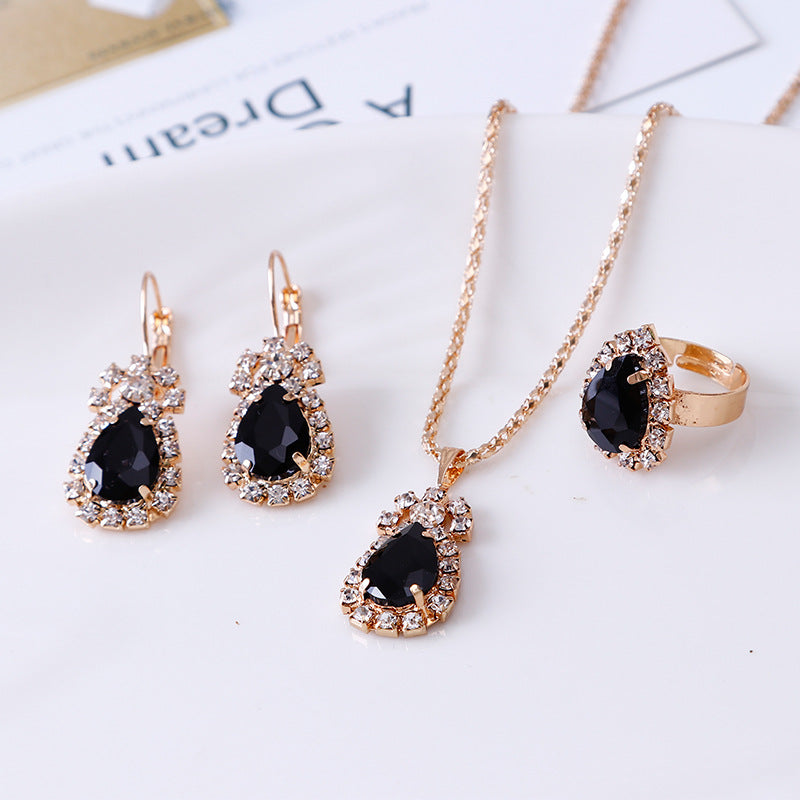 Conjunto de collar, pendientes y anillo con diseño de gota de agua